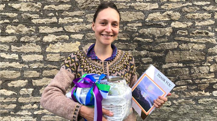 Music creator Hannah standing in front of a wall