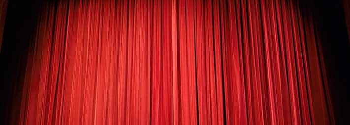 a closed pair of stage curtains