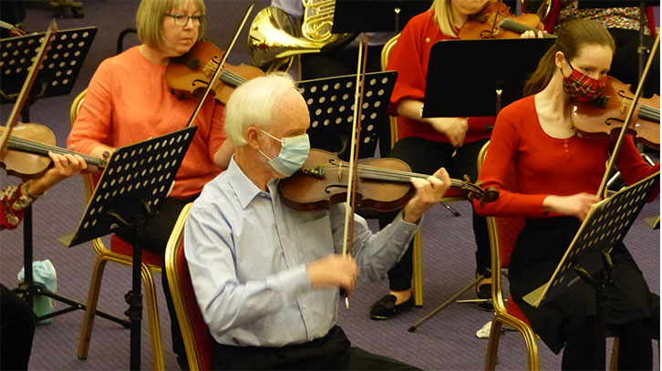 KOS leader Vince Gray playing Private Dunsire’s violin