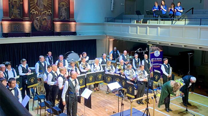 members of City of Bristol Brass Band on stage after a performance