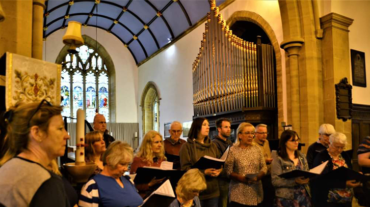 members of the choir singing in church