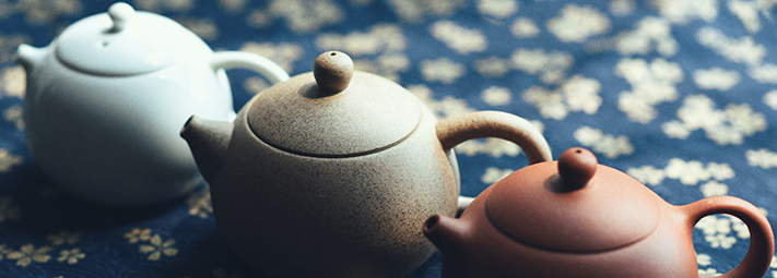 A row of teapots in different colours