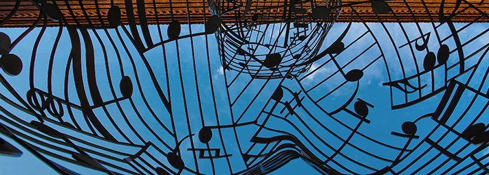 A flurry of black music notes on a stave