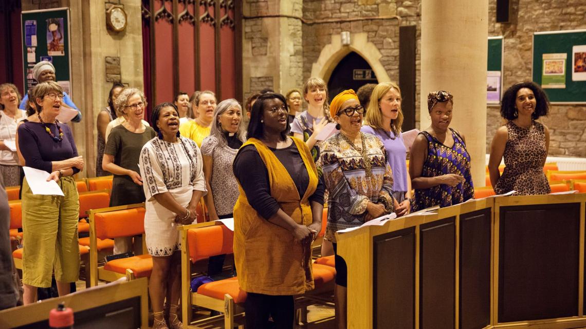 A group of women singing in church
