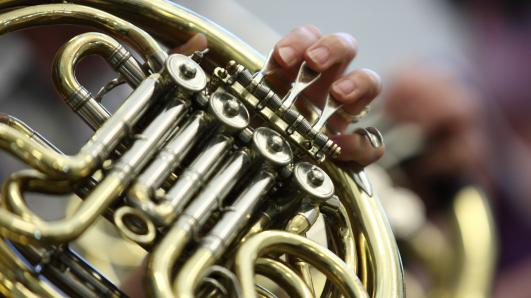 close up of a french horn being played