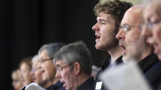Men singing together in a concert