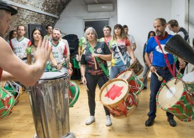 Group of people doing Brazilian drumming