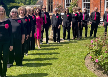 Photograph of the choir members taken at Danny House, an Elizabethan mansion in Hurstpierpoint, West Sussex.