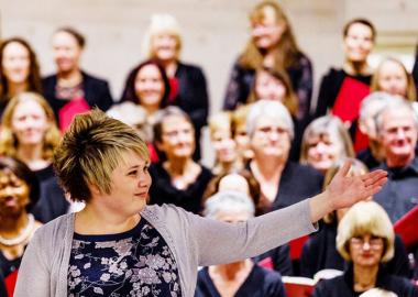 Hilary Campbell leads Bristol Choral Society through a performance