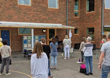 North Kingston Choir rehearse, socially distanced, in a school playground