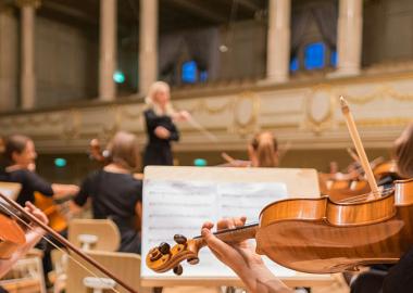 conductor with orchestra at rehearsal