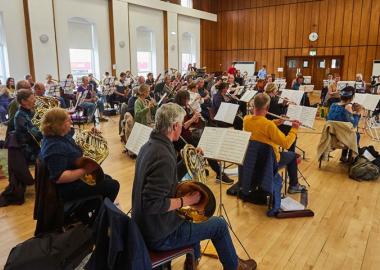 wind band rehearsal in community hall