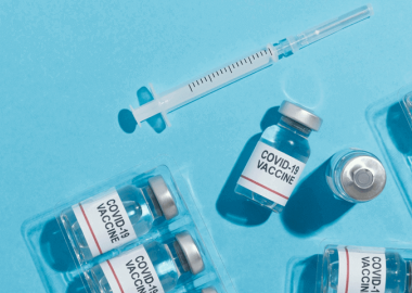 bottles of covid-19 vaccinations and needle