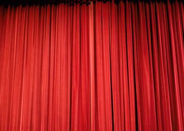 a closed red theatre curtain