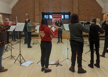 members of the flute ensemble during rehearsal