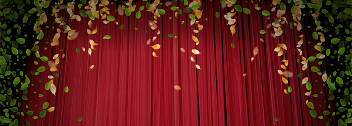 Red curtains framed by yellow and green leaves