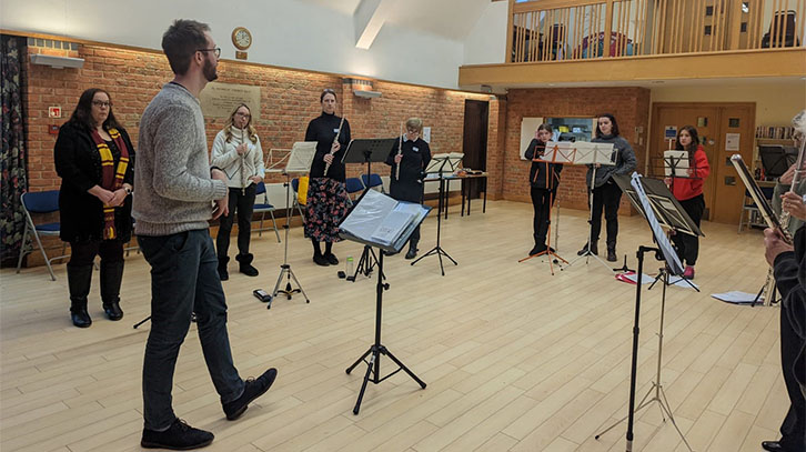 Edgar leading the flute ensemble rehearsal